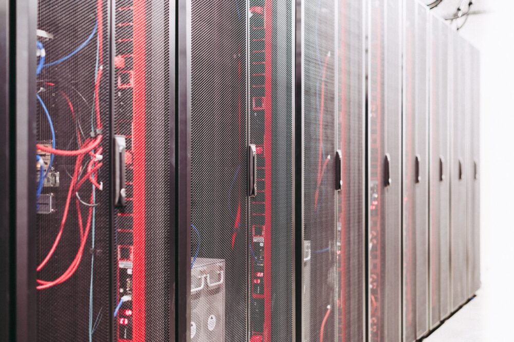 Data center under construction in a desert environment, rows of server racks and cooling infrastructure, Middle East